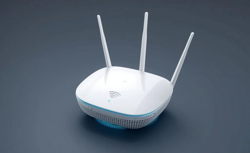 Aparece utilizado para os dispositivos móveis se conectar a internet. É Roteador WiFi 6 na Mesh na cor branca e com 3 antenas,